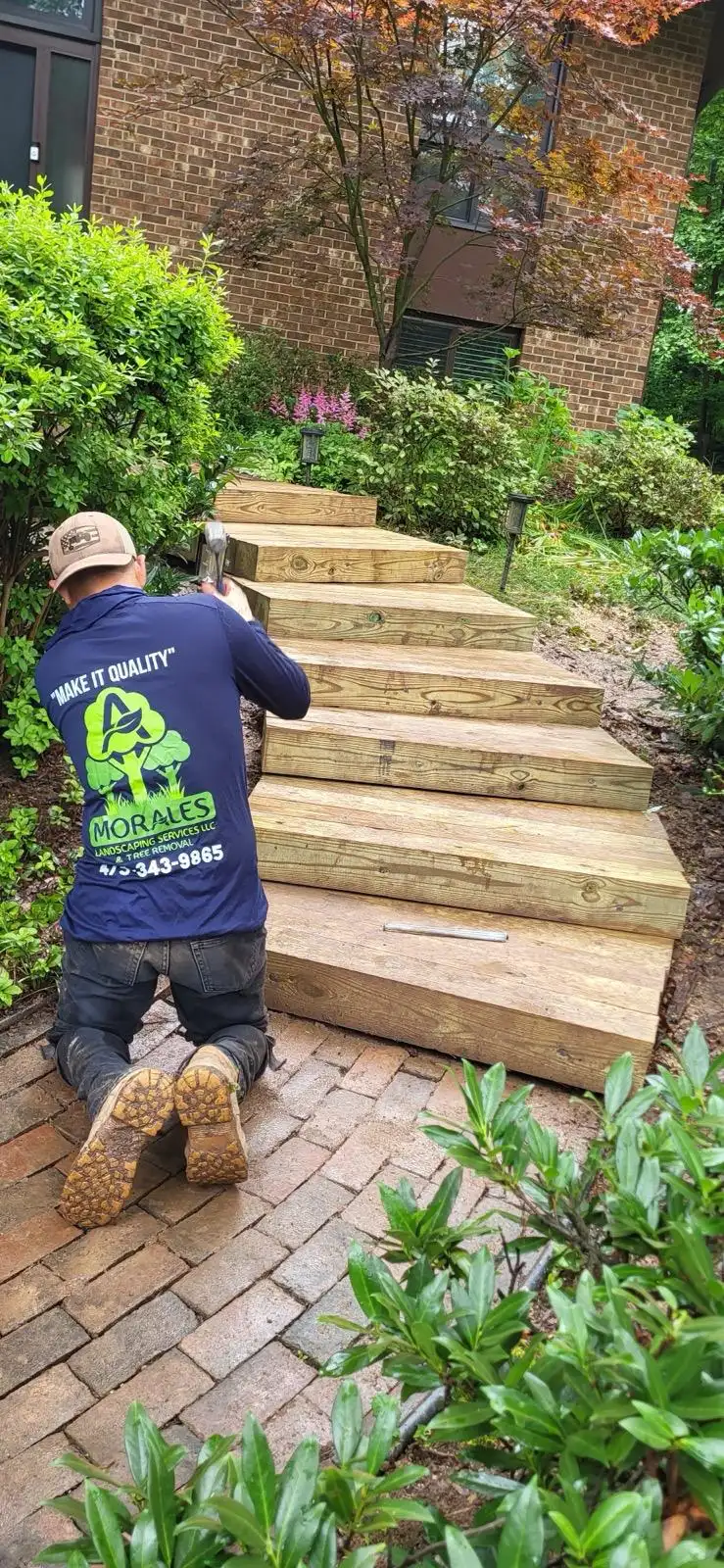 Amorales Landscaping Services crew after a tree removal job in Connecticut